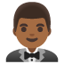 🤵🏾‍♂️ man in tuxedo: medium-dark skin tone display on Google